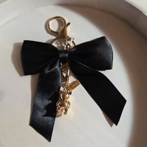 Elegant Black Bow Keychain with Coach Bear Gold Accents
